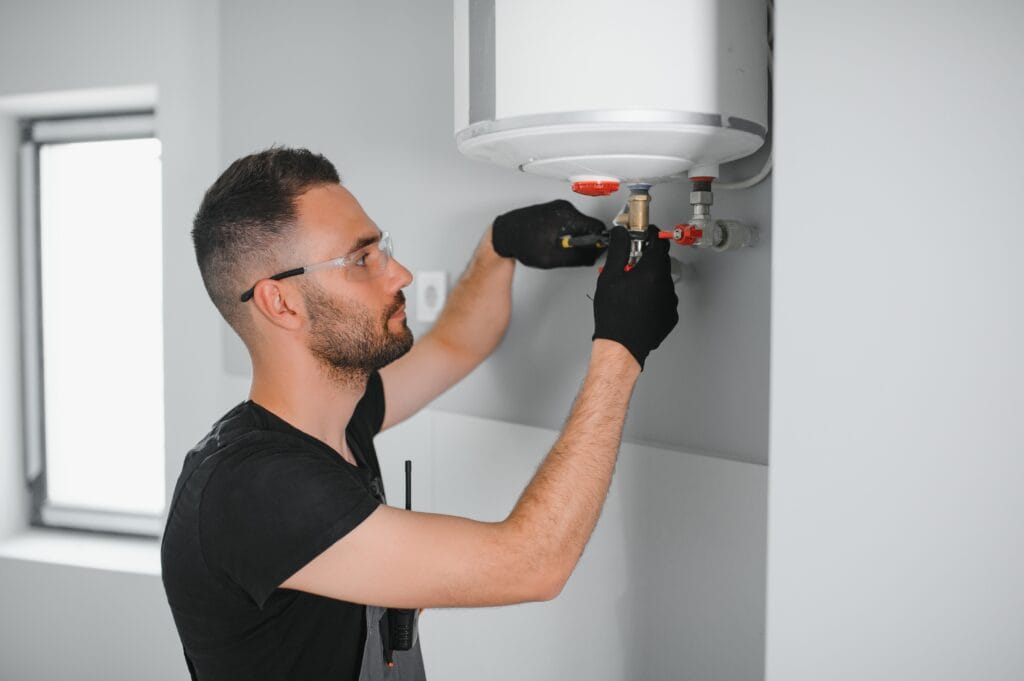 Technician performing water heater maintenance in Fontana